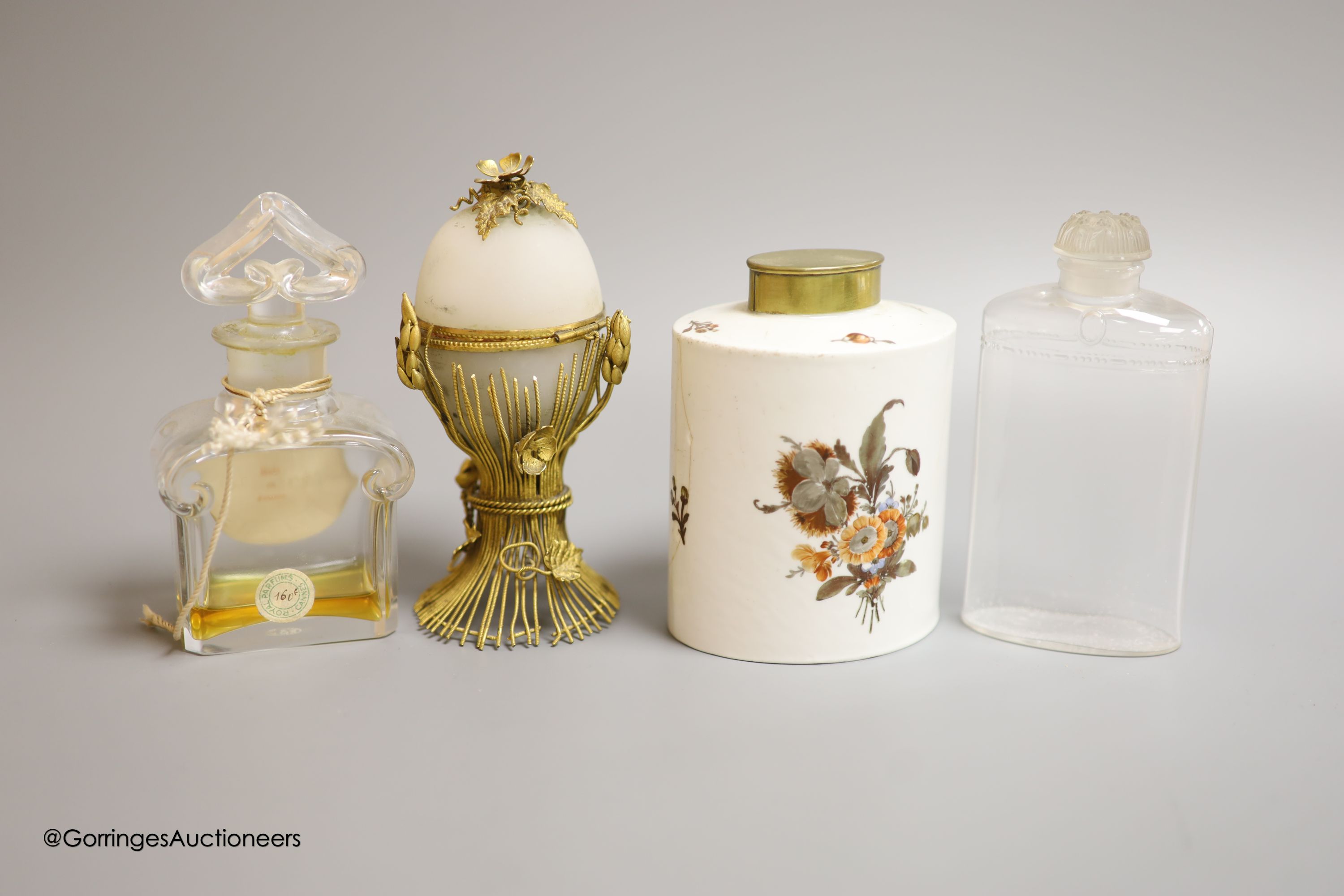 A gilt metal necessaire, a ceramic continental perfume bottle and a Guerlain and Coty perfume bottle